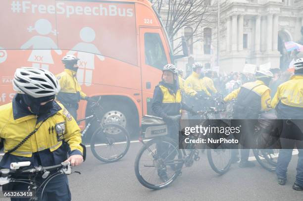 Police attempts to clear the path after counter protestors prevent a anti-Transgender Free Speech Bus from parking near City Hall, in Philadelphia,...