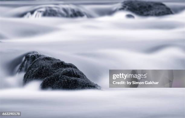 dreamlike photograph of flowing water - milk stream stock pictures, royalty-free photos & images