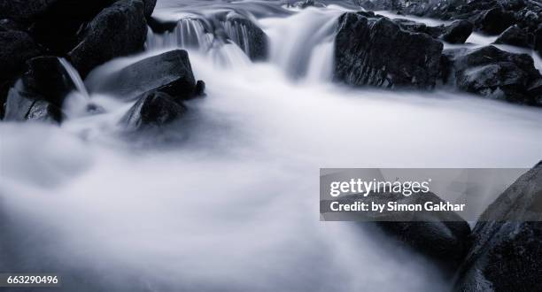 dreamlike photograph of flowing water - milk stream stock pictures, royalty-free photos & images