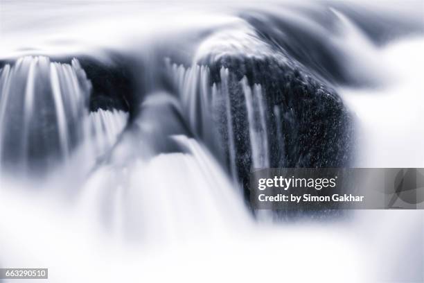 dreamlike photograph of flowing water - milk stream stock pictures, royalty-free photos & images