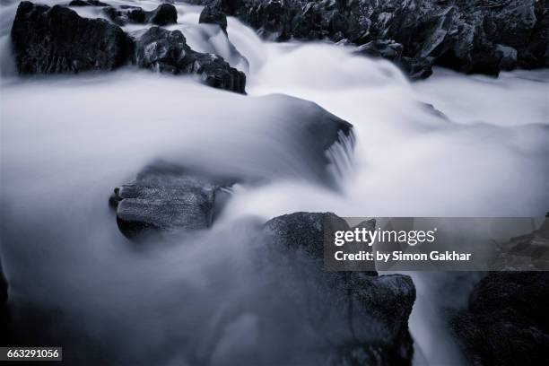 dreamlike photograph of flowing water - milk stream stock pictures, royalty-free photos & images