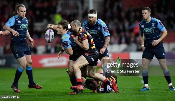 Blues wing Blaine Scully knocks the ball on under the challenge from Charlie Sharples of Gloucester during the European Rugby Challenge Cup match...