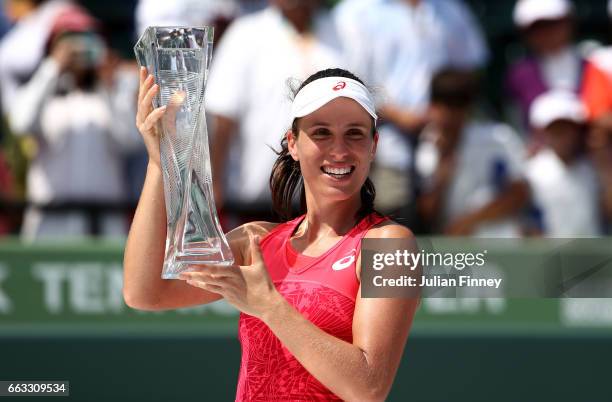 Johanna Konta of Great Britain celebrates with the Butch Buchholz trophy after winning the women's singles final match against Caroline Wozniacki of...