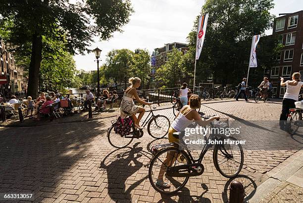 cyclists in amsterdam - amsterdam cycling stock pictures, royalty-free photos & images