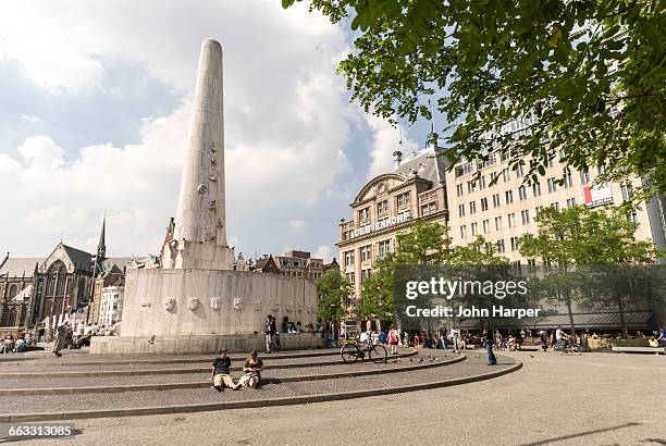 national monument, amsterdam - dam square stock pictures, royalty-free photos & images