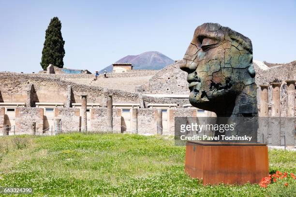 igor mitoraj sculpture exhibition in pompeii - igor mitoraj stock pictures, royalty-free photos & images