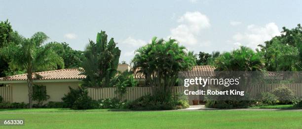 Simpson's new $625,000 house sits behind palm trees September 27, 2000 in Miami. The house has five bedrooms, four baths, a pool, and guest house set...