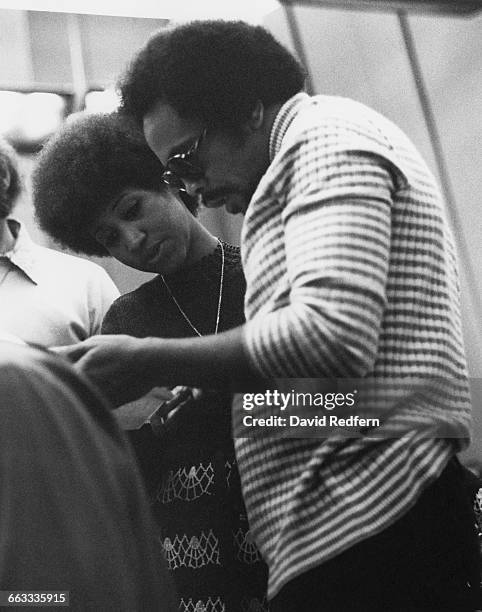 American soul singer Aretha Franklin in a recording studio with composer and record producer Quincy Jones, circa 1973.