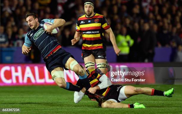 Blues player Sam Warburton is tackled by Jonny May of Gloucester during the European Rugby Challenge Cup match between Gloucester Rugby and Cardiff...