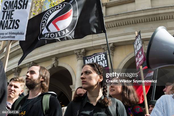 Members of anti-fascist groups, Unite Against Fascism and Antifaschistische Aktion seen during a counter-demonstration to oppose far-right Britain...