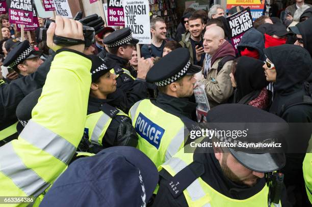 Members of anti-fascist groups, Unite Against Fascism and Antifaschistische Aktion clash with police forces during a counter-demonstration to oppose...