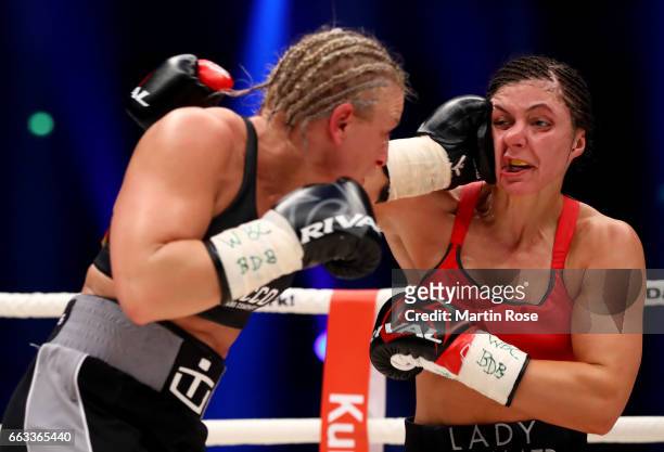 Christina Hammer of Germany and Maria Lindberg of Sweden exchange punches during their WBC middleweight World Championship title fight at...