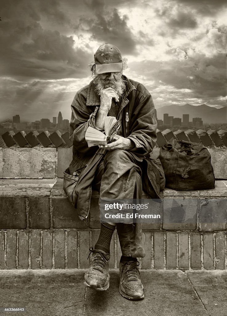 Homeless Man Reading Book