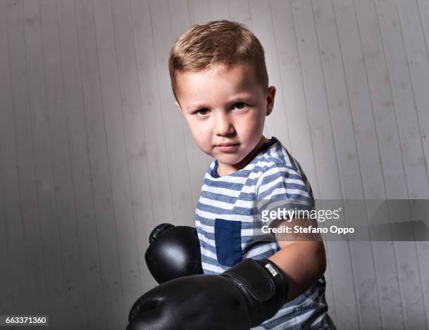 kid with boxing gloves - sfondo bianco stock pictures, royalty-free photos & images
