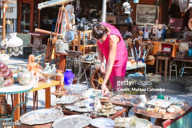 woman in a flea market in the center of athens, greece - flea market stockfoto's en -beelden