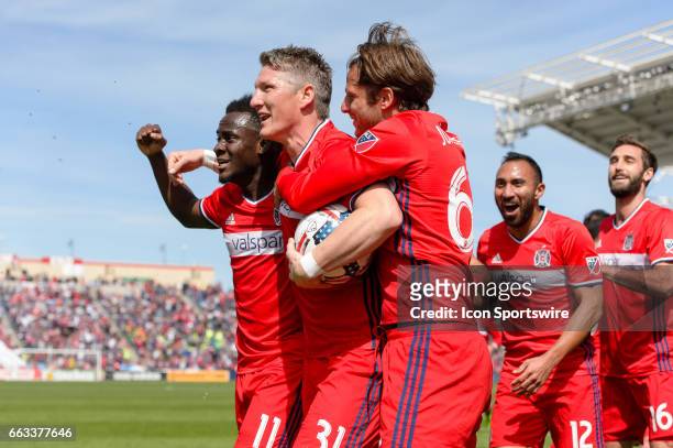 Chicago Fire midfielder Bastian Schweinsteiger celebrates scoring a goal in the first half with Chicago Fire forward David Accam and Chicago Fire...