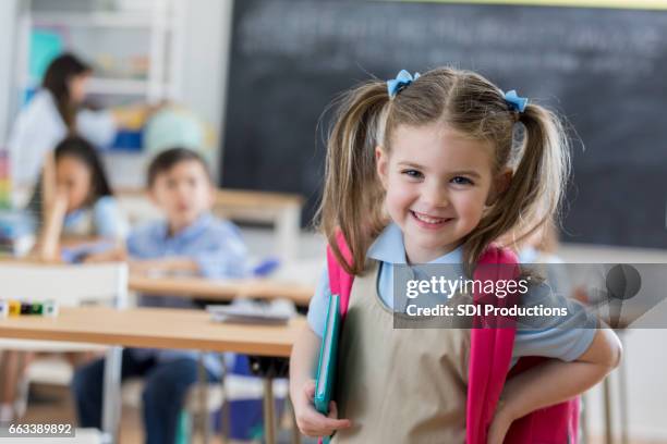 confident preschooler in her classroom - back to school stock pictures, royalty-free photos & images