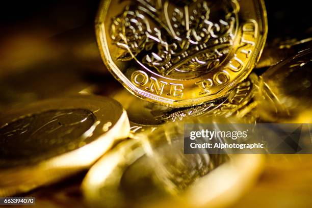new pound coin released 2017 - gold coins pile stock pictures, royalty-free photos & images