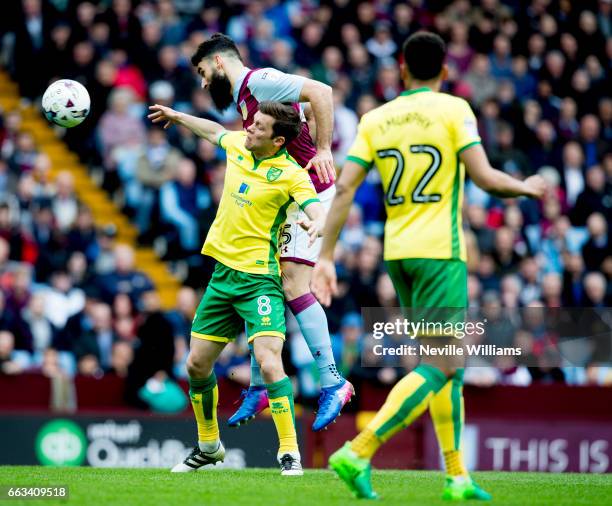 Mile Jedinak of Aston Villa is challenged by Jonny Howson of Norwich City during the Sky Bet Championship match between Aston Villa and Norwich City...