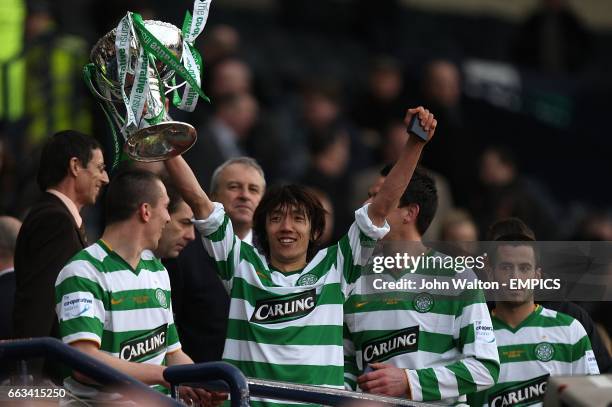 Celtic's Shunsuke Nakamura celebrates with his team mates as he raises the trophy