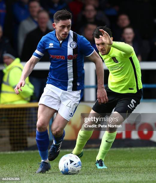 Ian Henderson of Rochdale controls the ball watched by Zander Diamond of Northampton Town during the Sky Bet League One match between Rochdale and...