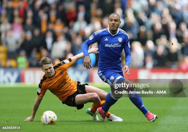 Dave Edwards of Wolverhampton Wanderers and Kenneth Zohore of Cardiff City during the Sky Bet Championship match between Wolverhampton Wanderers and...