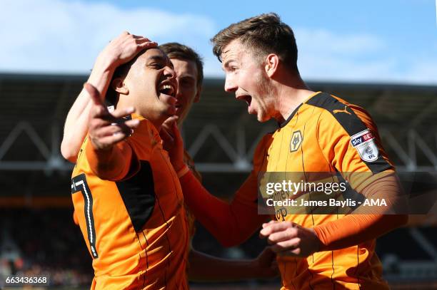 Helder Costa of Wolverhampton Wanderers celebrates after scoring a goal to make it 3-1 with Lee Evans the Sky Bet Championship match between...