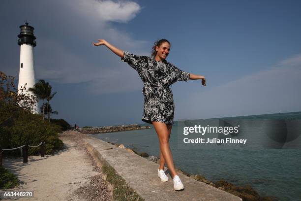 Johanna Konta of Great Britain poses next to a lighthouse during a photo shoot after she defeated Caroline Wozniacki of Denmark in the final at Cape...