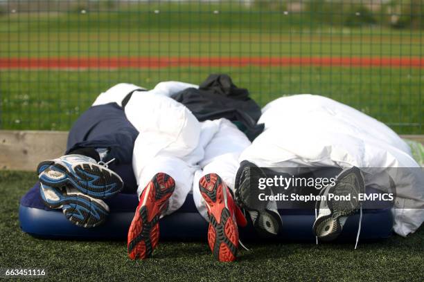 Players take a nap as they attempt to break the world record for a continuous game of 11 a side football