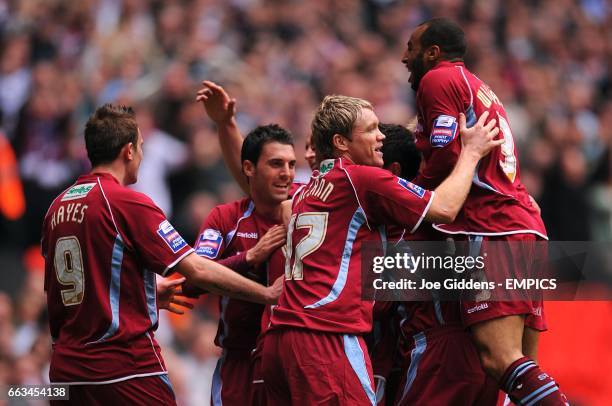 Scunthorpe United's Gary Hooper is mobbed by his teammates after scoring his sides first goal of the game