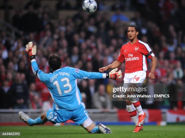 Arsenal's Theo Walcott scores the first goal past Villarreal's goalkeeper Diego Lopez