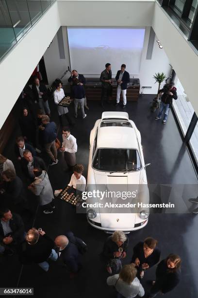 Guests at the brand experience destination "Porsche auf Sylt" during the Grand Opening on April 1, 2017 in Westerland, Germany. German car...