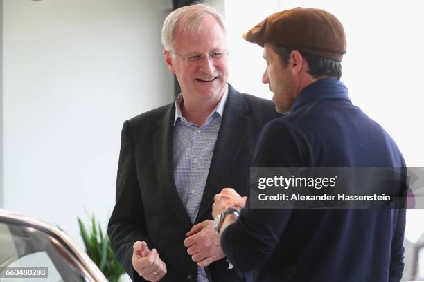 Jens Puttfarcken , CEO Porsche Deutschland GmbH talks to Hollywood actor and racecar driver Patrick Dempsey at the brand experience destination...