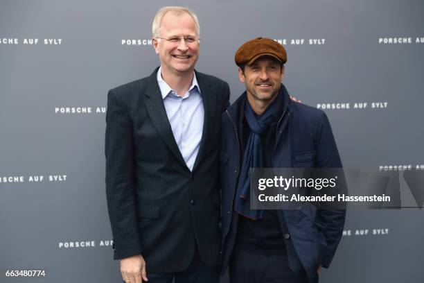 Jens Puttfarcken , CEO Porsche Deutschland GmbH arrives with Hollywood actor and racecar driver Patrick Dempsey at the brand experience destination...