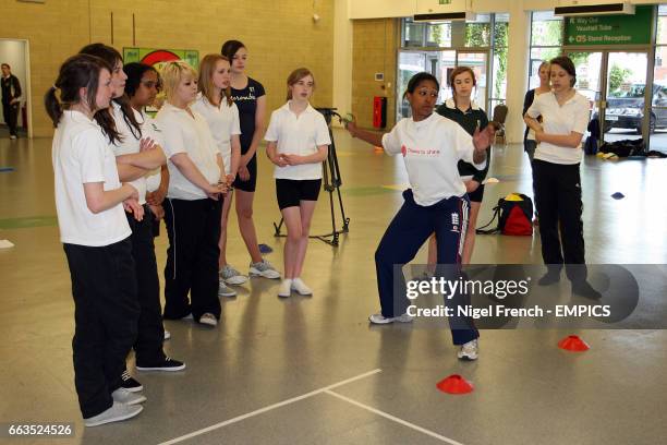 Surrey's Ebony Rainford Brent gives a coaching session to School girls in the Lambeth Hall