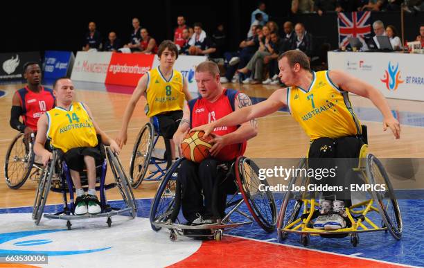 Australia's Shaun Norris tries to steal the ball from Great Britain's Peter Finbow during their wheelchair basketball match