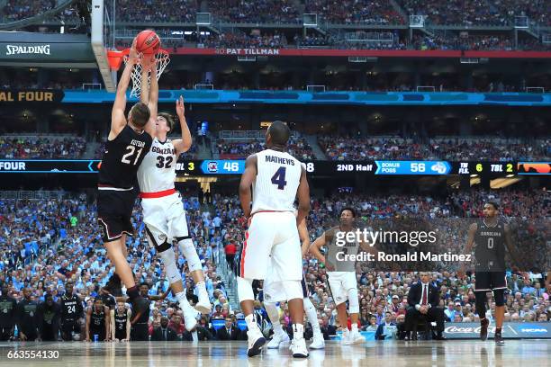 Maik Kotsar of the South Carolina Gamecocks shoots against Zach Collins of the Gonzaga Bulldogs in the second half during the 2017 NCAA Men's Final...