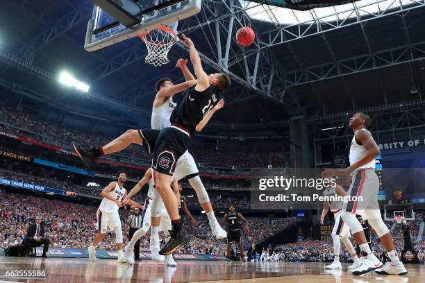 Zach Collins of the Gonzaga Bulldogs defends Maik Kotsar of the South Carolina Gamecocks in the second half during the 2017 NCAA Men's Final Four...