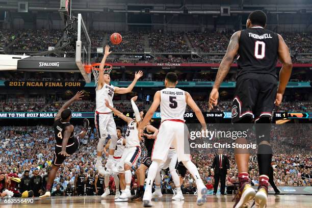 Zach Collins of the Gonzaga Bulldogs reaches for a defensive rebound during the 2017 NCAA Photos via Getty Images Men's Final Four Semifinal against...