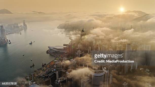 hong kong from air at sun rise - air pollution stock pictures, royalty-free photos & images