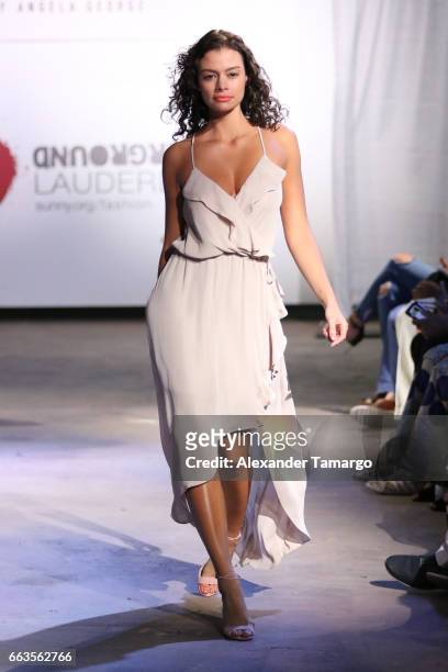 Model walks the runway wearing Alice & Trixie by Angela George at Underground Lauderdale Fashion Weekend Brought To You By The Greater Fort...