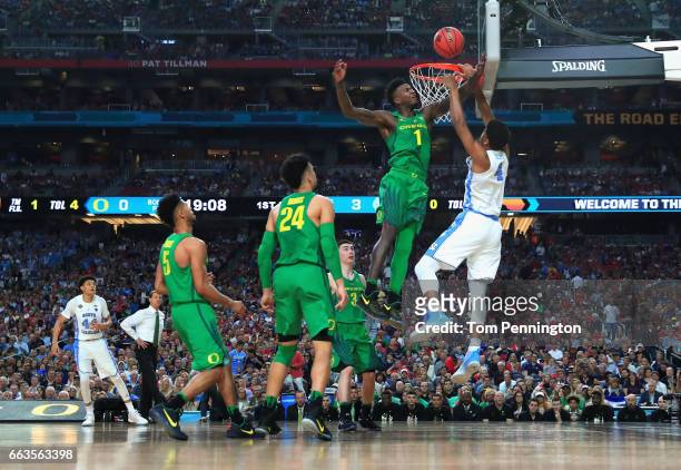 Isaiah Hicks of the North Carolina Tar Heels goes up with the ball against Jordan Bell of the Oregon Ducks in the first half during the 2017 NCAA...