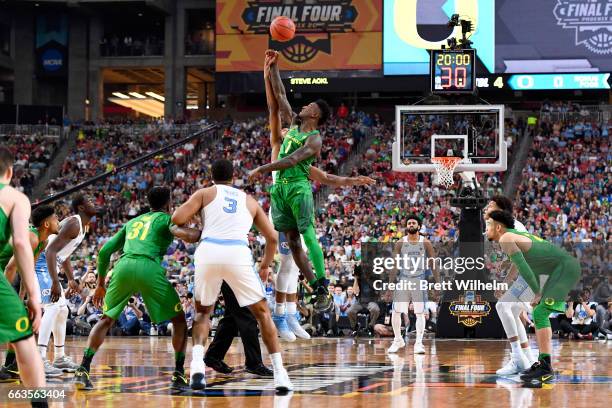 Tip-off against Jordan Bell of the Oregon Ducks and Isaiah Hicks of the North Carolina Tar Heels during the 2017 NCAA Photos via Getty Images Men's...