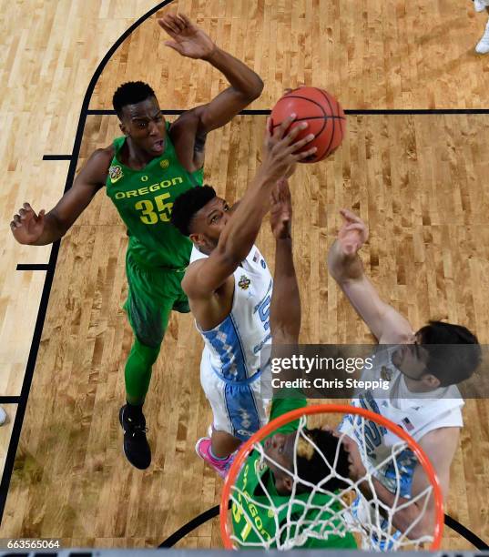 Tony Bradley of the North Carolina Tar Heels gets a rebound over Dylan Ennis of the Oregon Ducks during the 2017 NCAA Photos via Getty Images Men's...