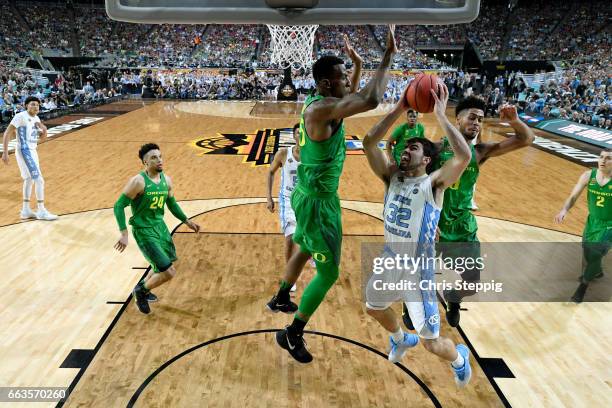 Luke Maye of the North Carolina Tar Heels Tyler Dorsey of the Oregon Ducks defends against during the 2017 NCAA Photos via Getty Images Men's Final...