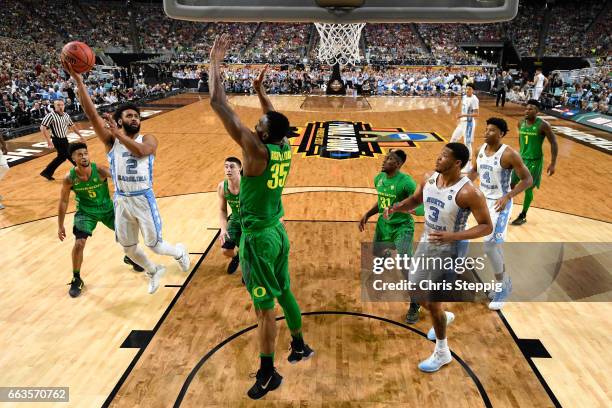 Joel Berry II of the North Carolina Tar Heels shoots the ball over Kavell Bigby-Williams of the Oregon Ducks during the 2017 NCAA Photos via Getty...