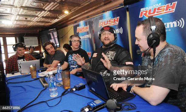 Ales Metz, Larry Dallas, Dave LaGreca, Wrestler Bully Ray and Doug Mortman laugh during the SiriusXM's Busted Open Live From WrestleMania 33on April...