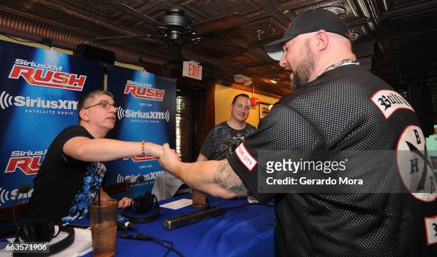 Dave LaGreca and Wrestler Bully Ray greet during SiriusXM's Busted Open Live From WrestleMania 33on April 1, 2017 in Orlando City.