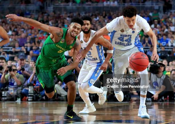 Tyler Dorsey of the Oregon Ducks and Justin Jackson of the North Carolina Tar Heels compete for the ball in the second half during the 2017 NCAA...