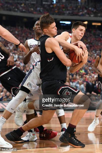 Maik Kotsar of the South Carolina Gamecocks battles for the ball with Zach Collins of the Gonzaga Bulldogs during the 2017 NCAA Photos via Getty...